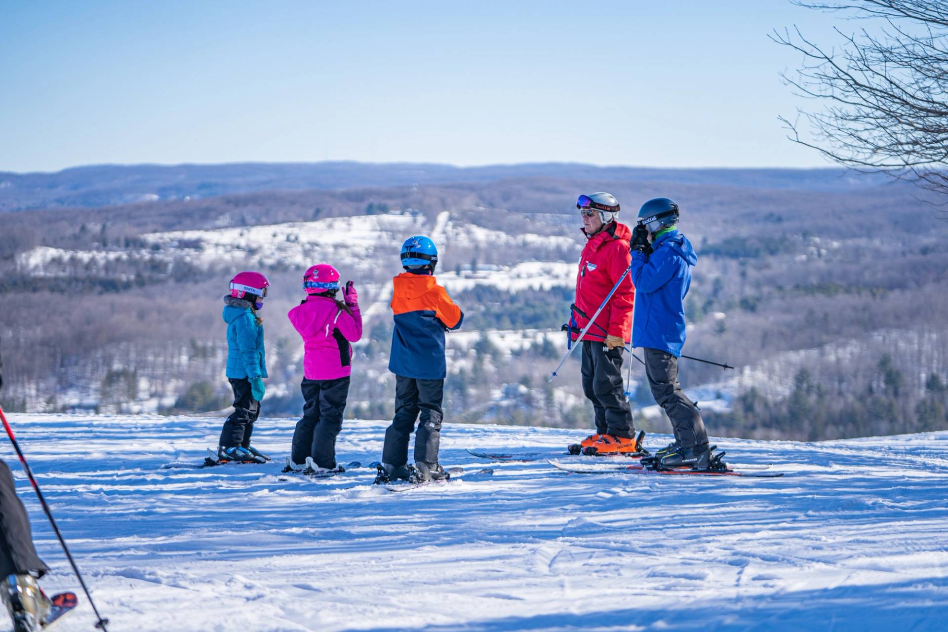 ski instructor giving an adult lesson
