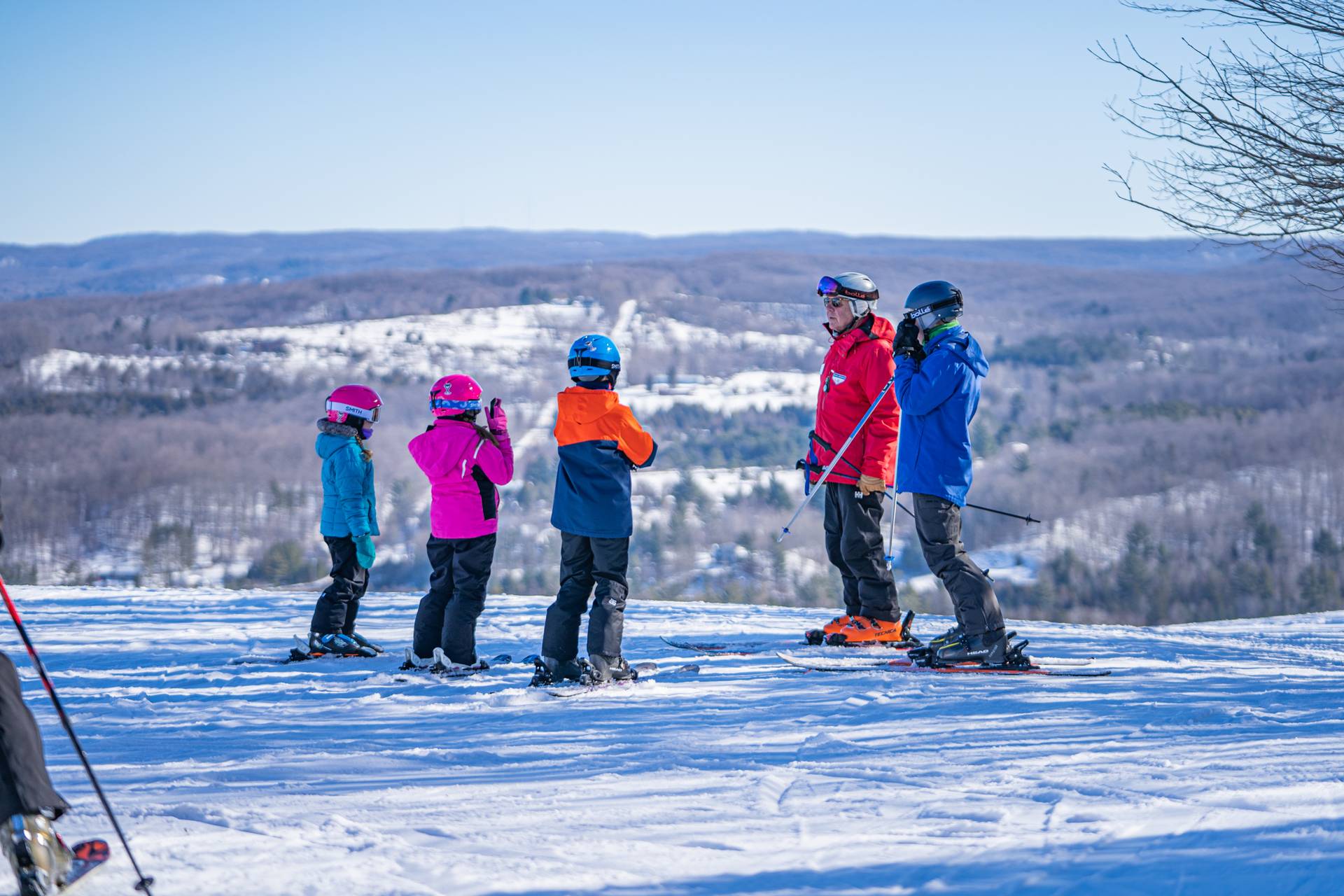ski instructor giving an adult lesson