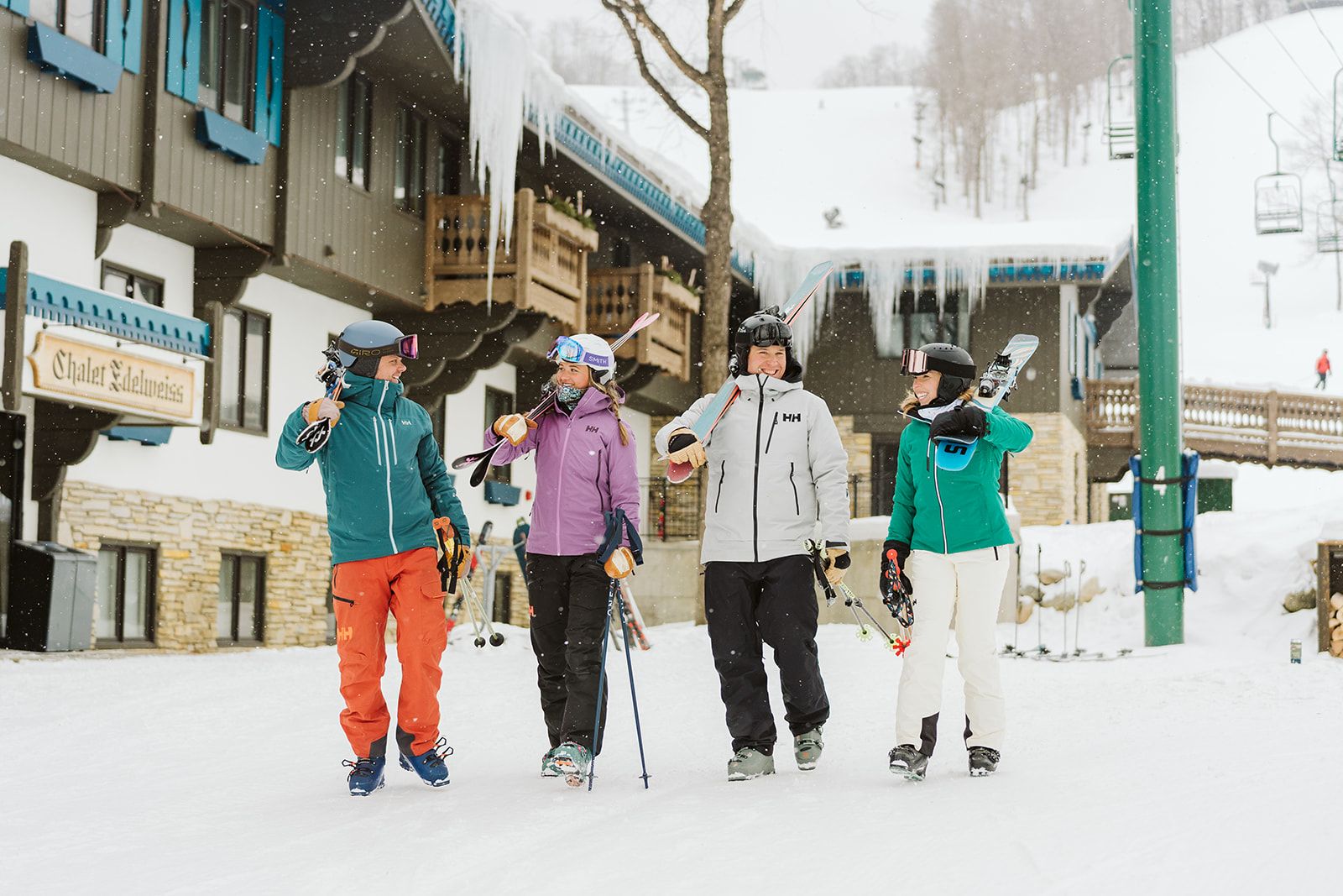 Skiers walking out of the Mountain Grand Lodge and Spa