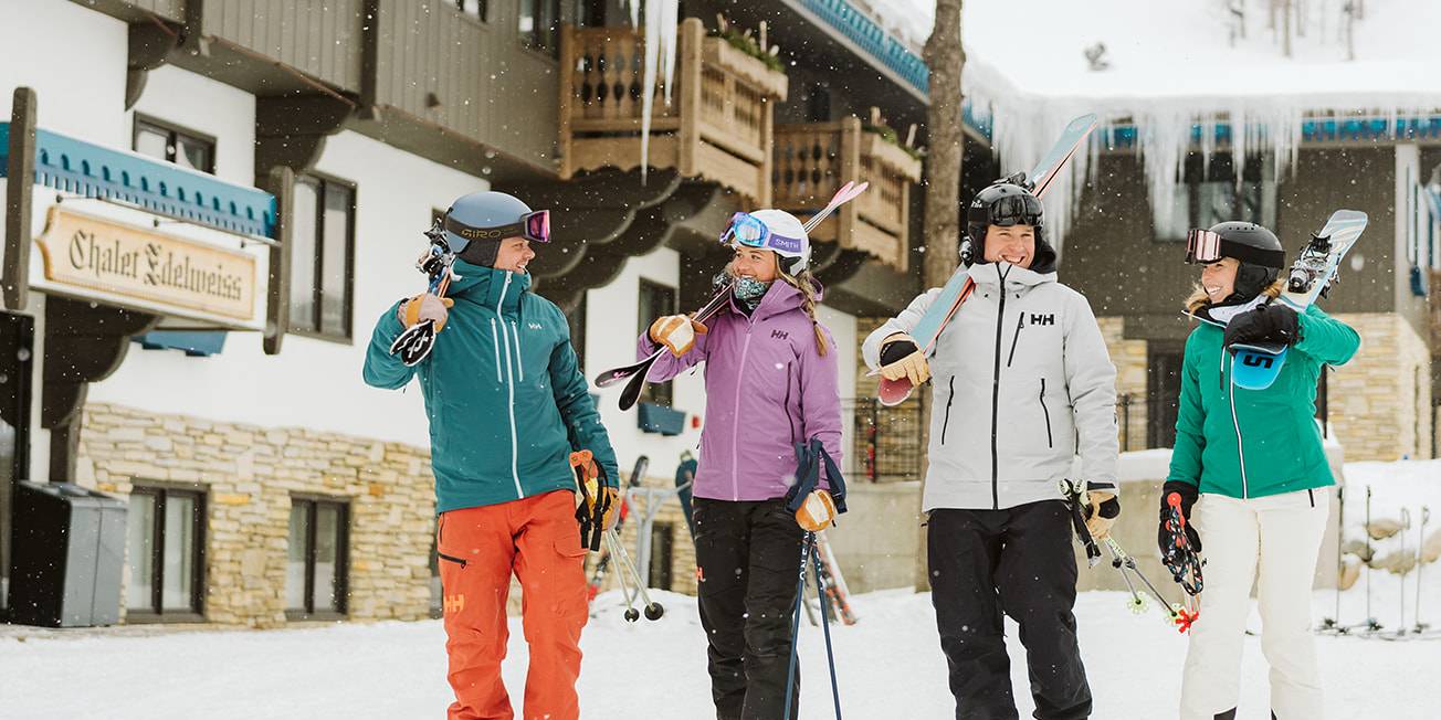 Skiers walking out of the Mountain Grand Lodge and Spa