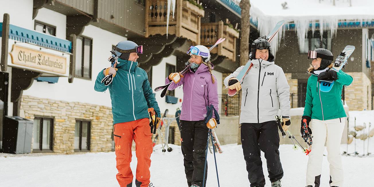 Skiers walking out of the Mountain Grand Lodge and Spa