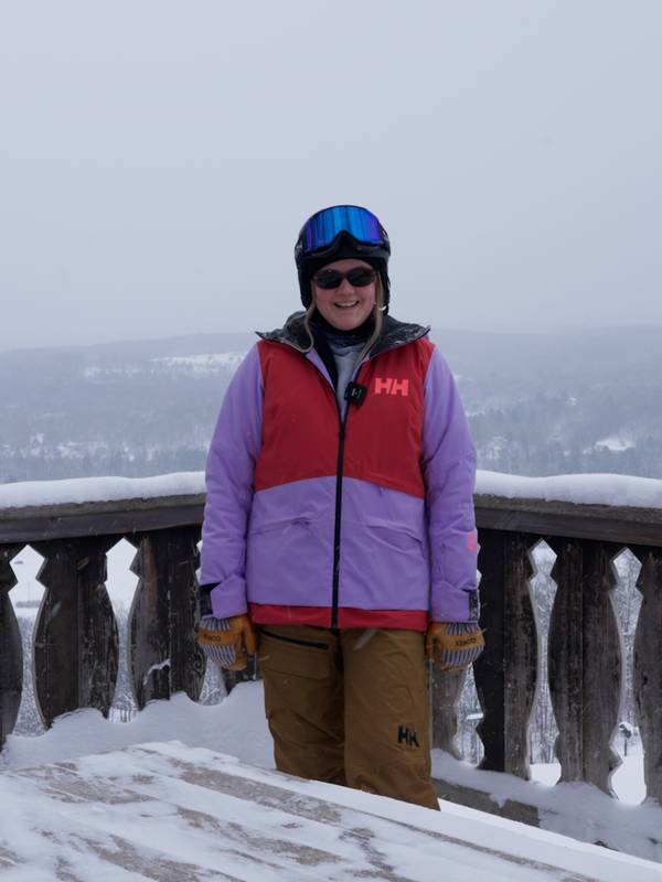 Woman standing with Mountain in background