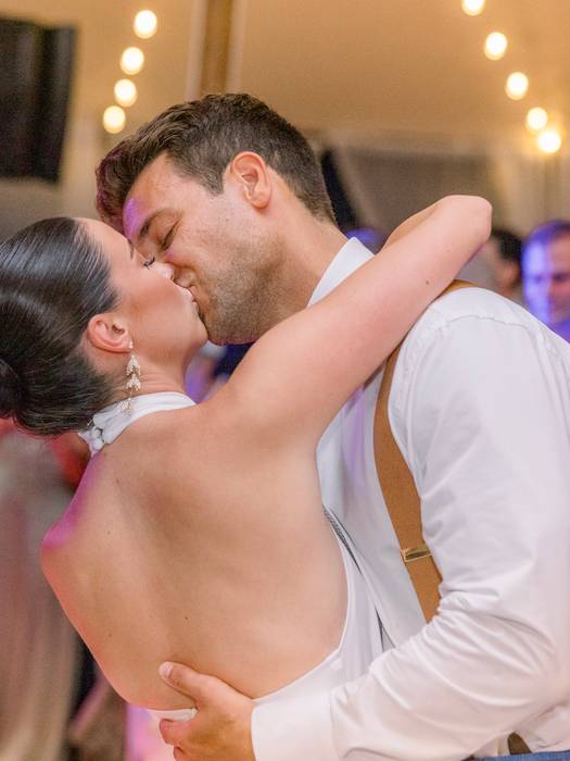 wedding couple kissing at reception