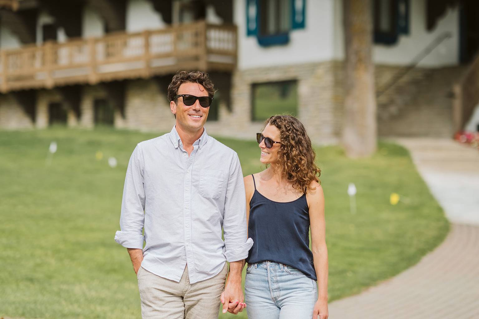 Couple Walking down path near hotel