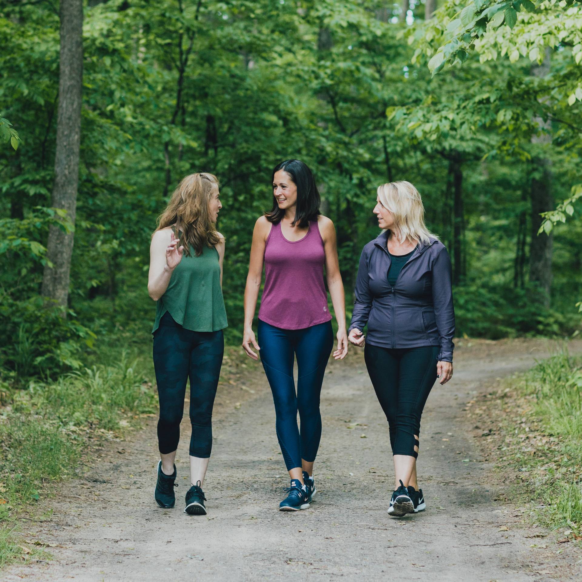 Three ladies hiking on a hiking trail