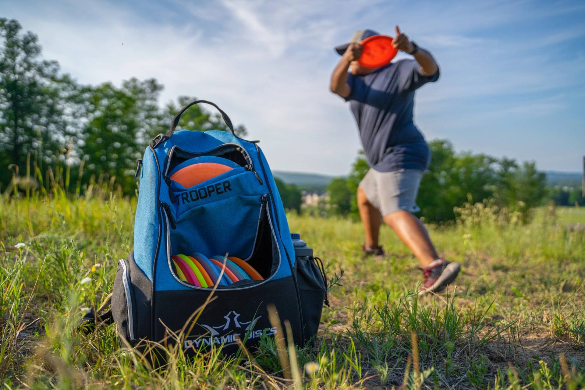 guest playing disc golf