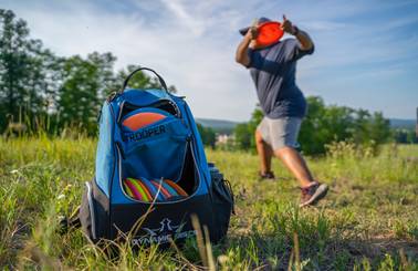 guest playing disc golf