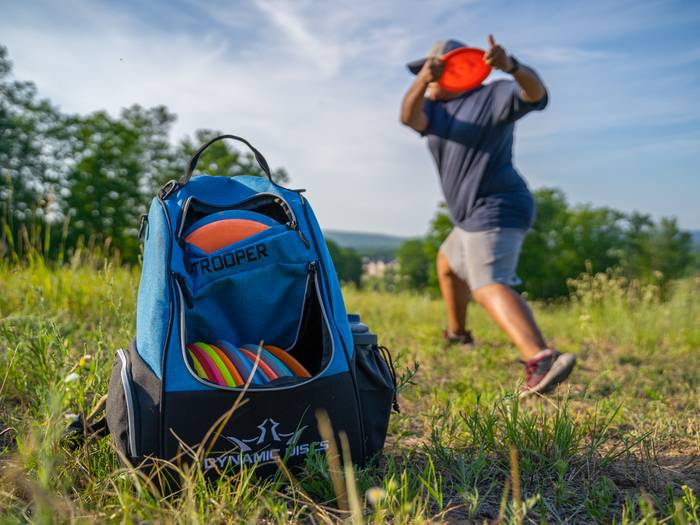 person disc golfing