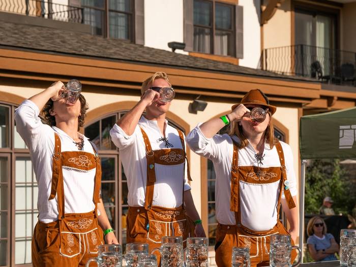 Guys drinking beer in Lederhosen