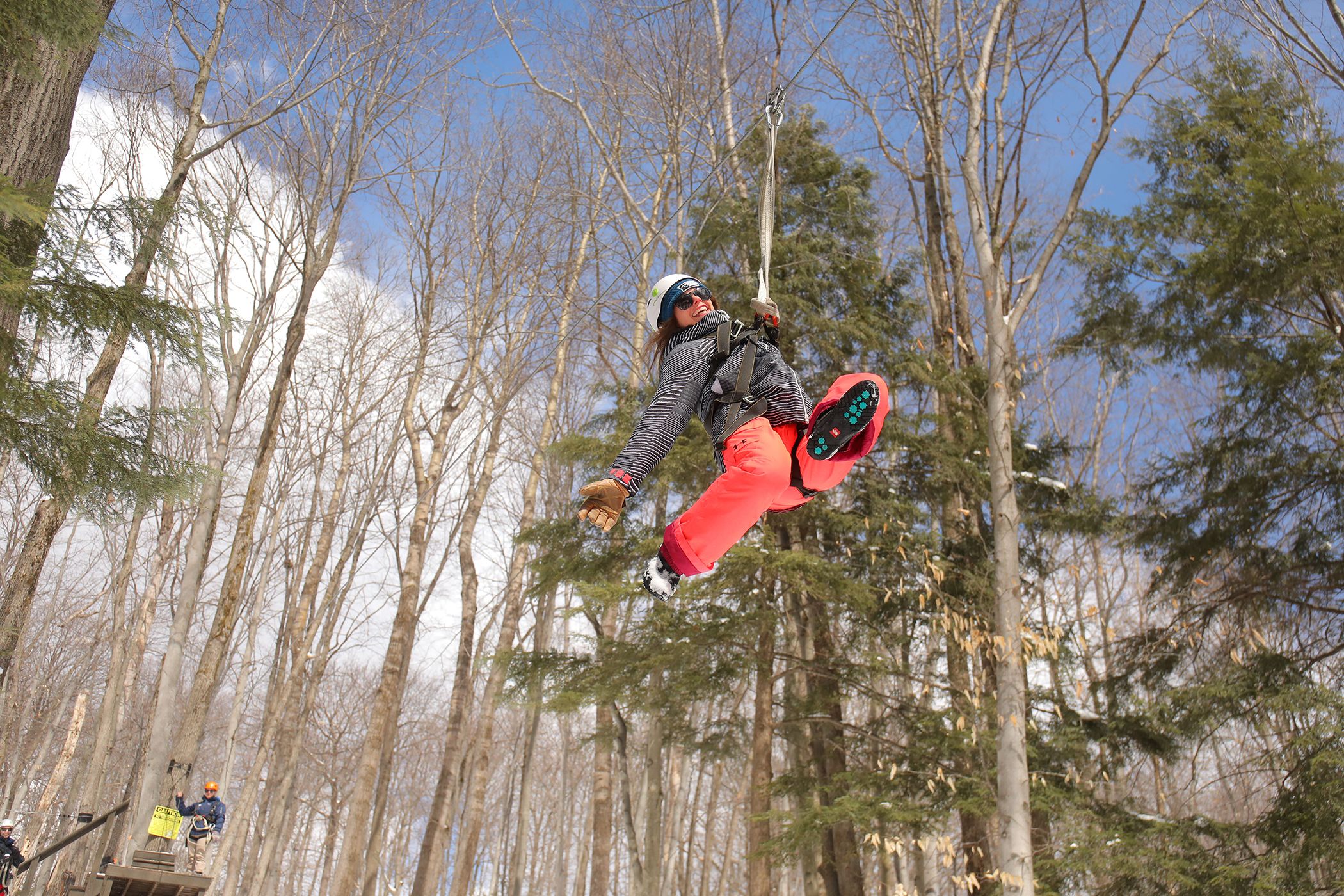Lady ziplining in the winter