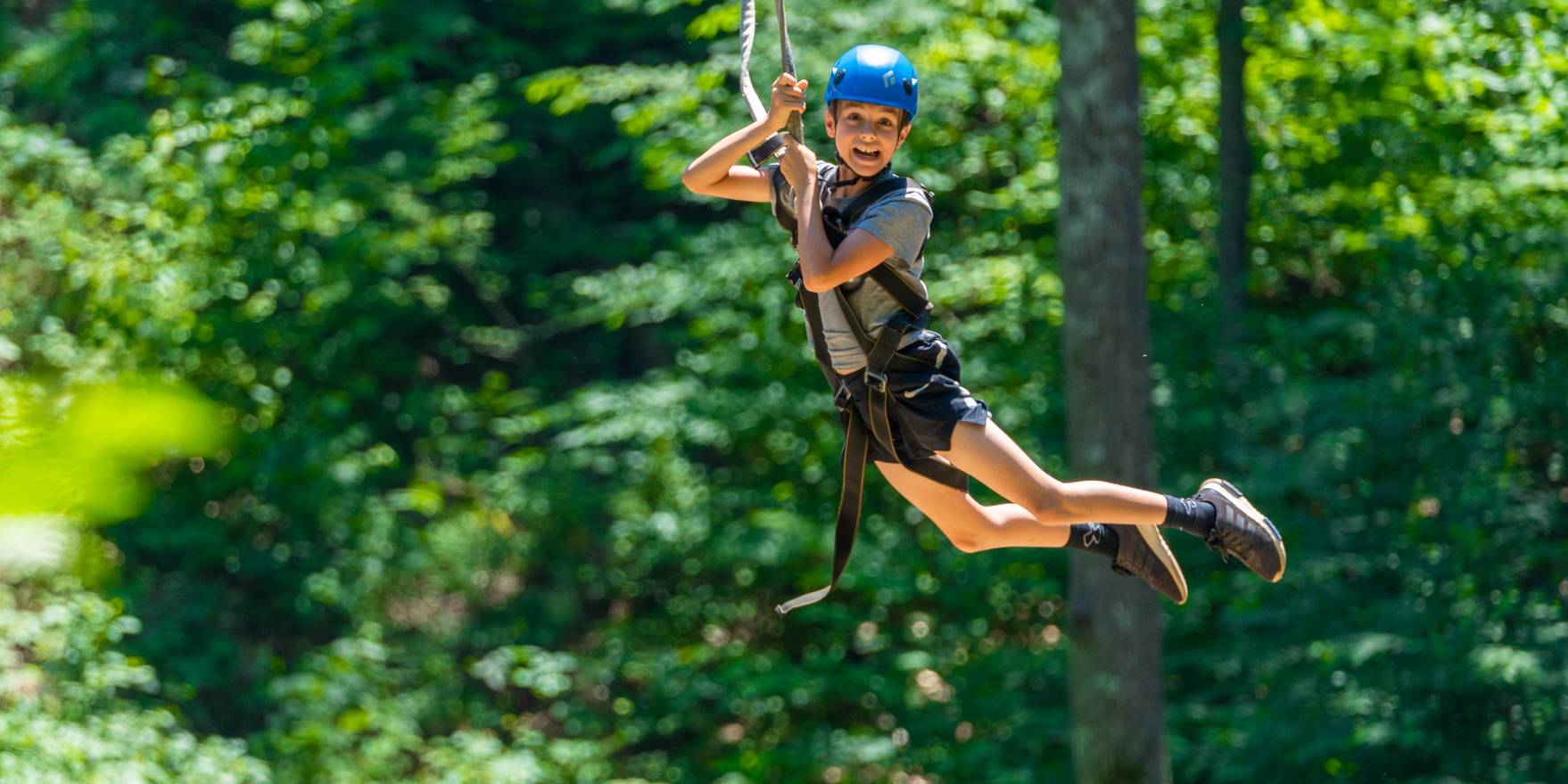 child on zipline tour