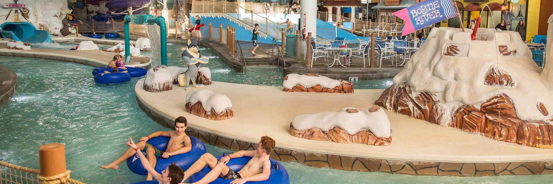 teens in the lazy river at avalanche bay