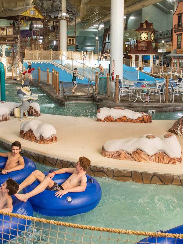 teens in the lazy river at avalanche bay