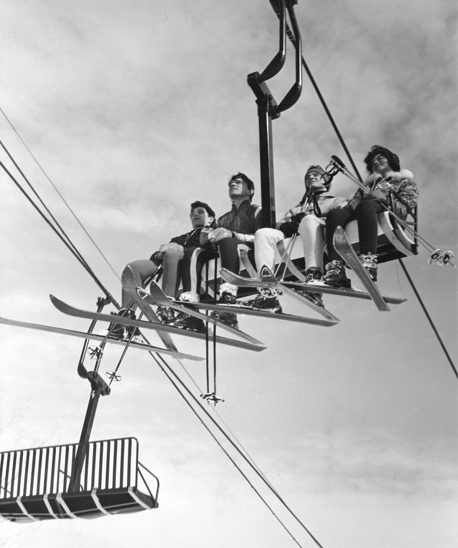 archive photo of skiers on chairlift