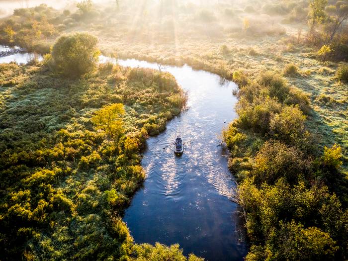 River boat fishing at sunset