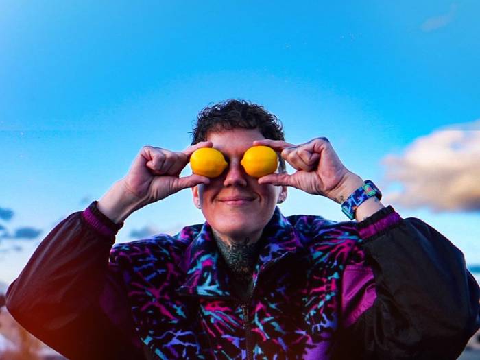 Photo of DJ Jenn N Juice holding lemons as eyes