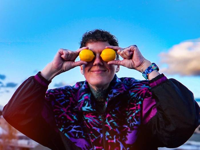 Girls sitting on a picnic table in the Back Forty