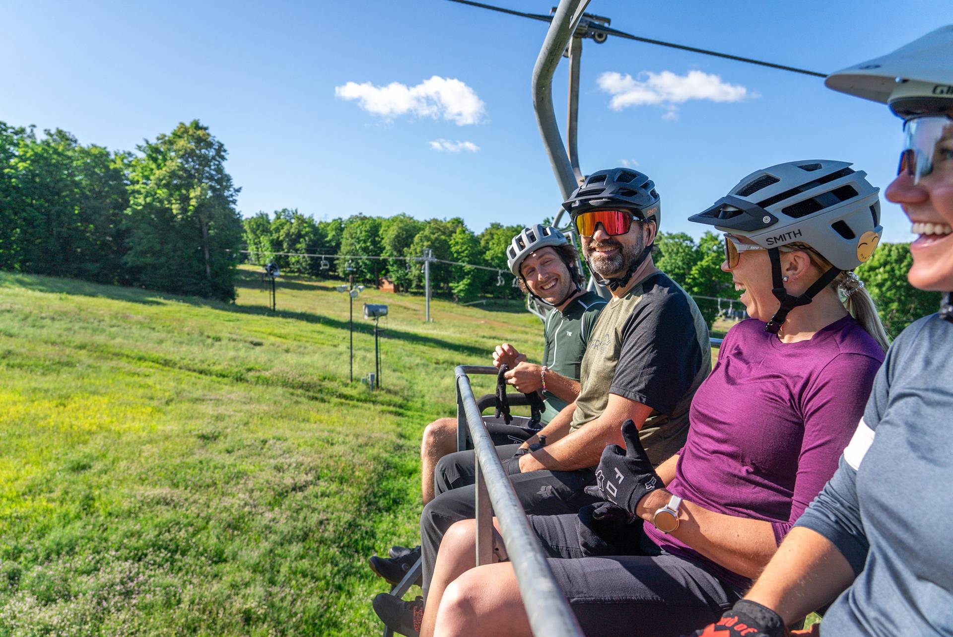 mountain bikers riding mountain express lift