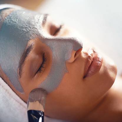 Woman getting a facial at The Spa