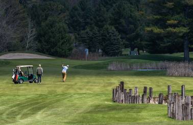 guy swinging golf club