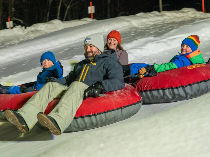 family tubing in the evening