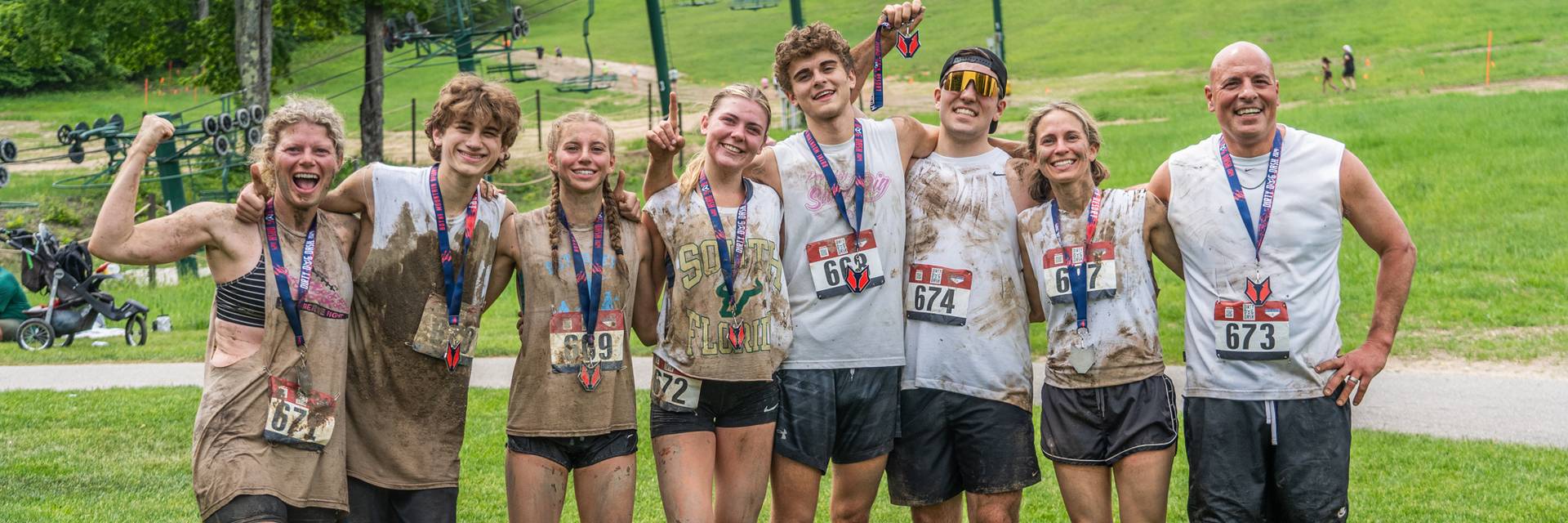 Man crawling in the mud at Dirty Dog Dash 5k Mud Run