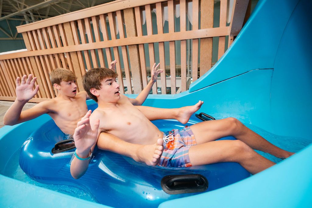 two kids on a waterslide