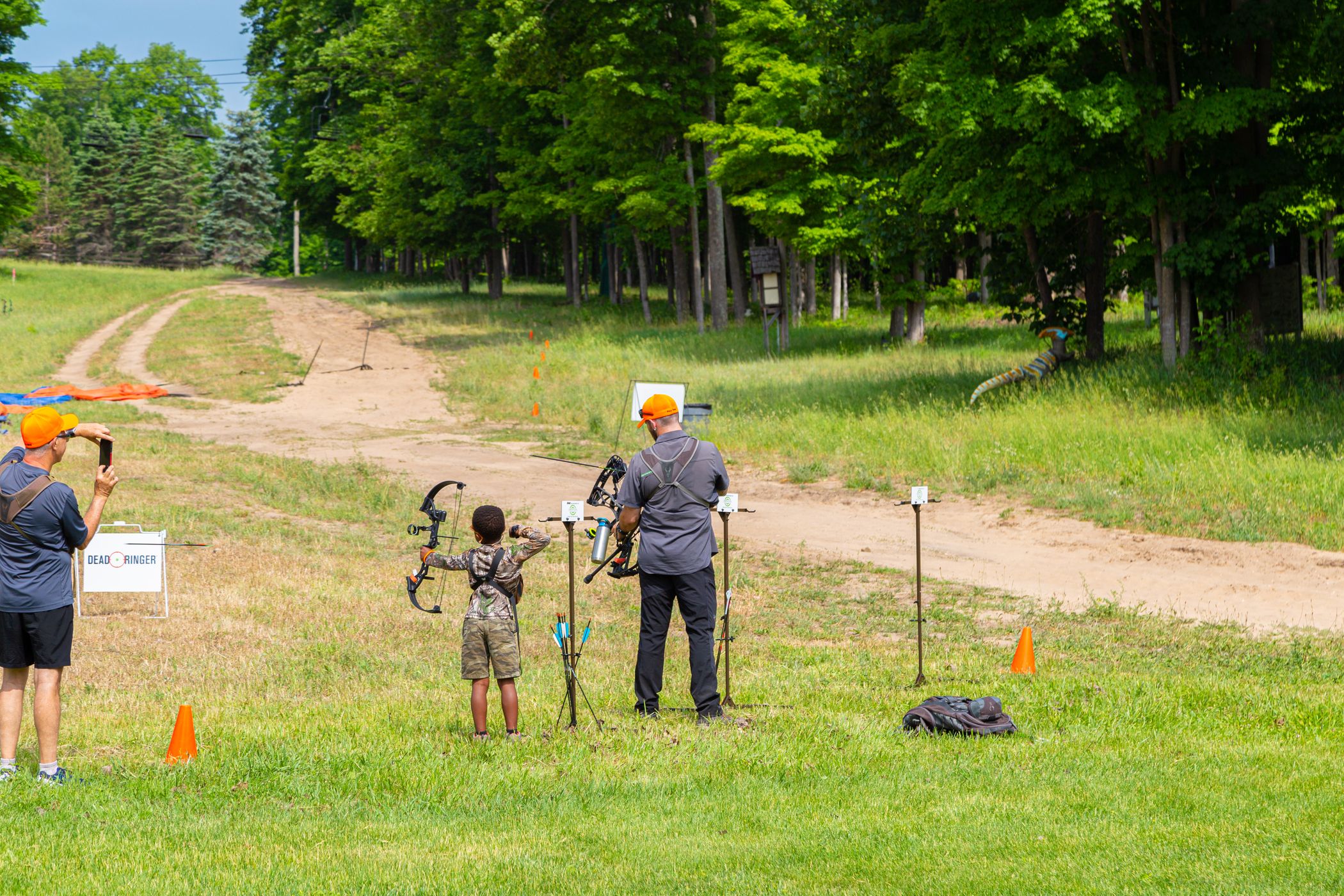 Father and son shooting arrows