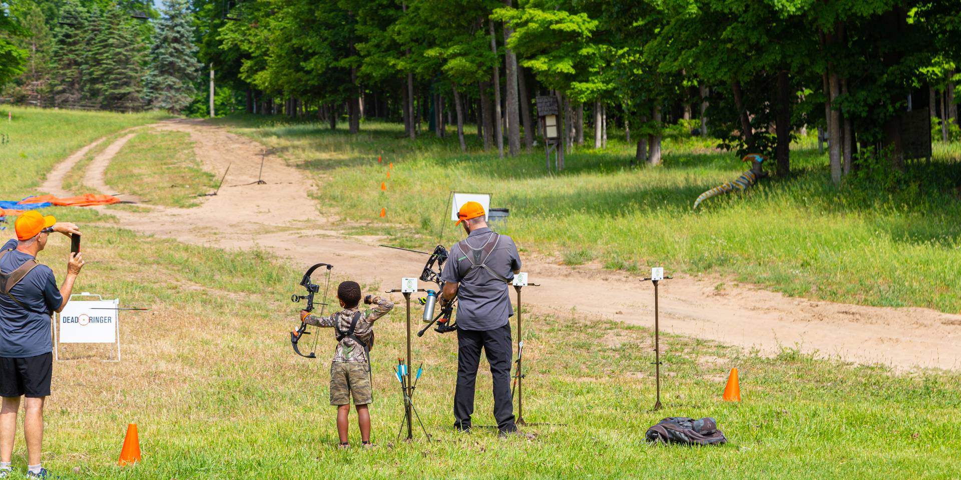 Father and son shooting arrows