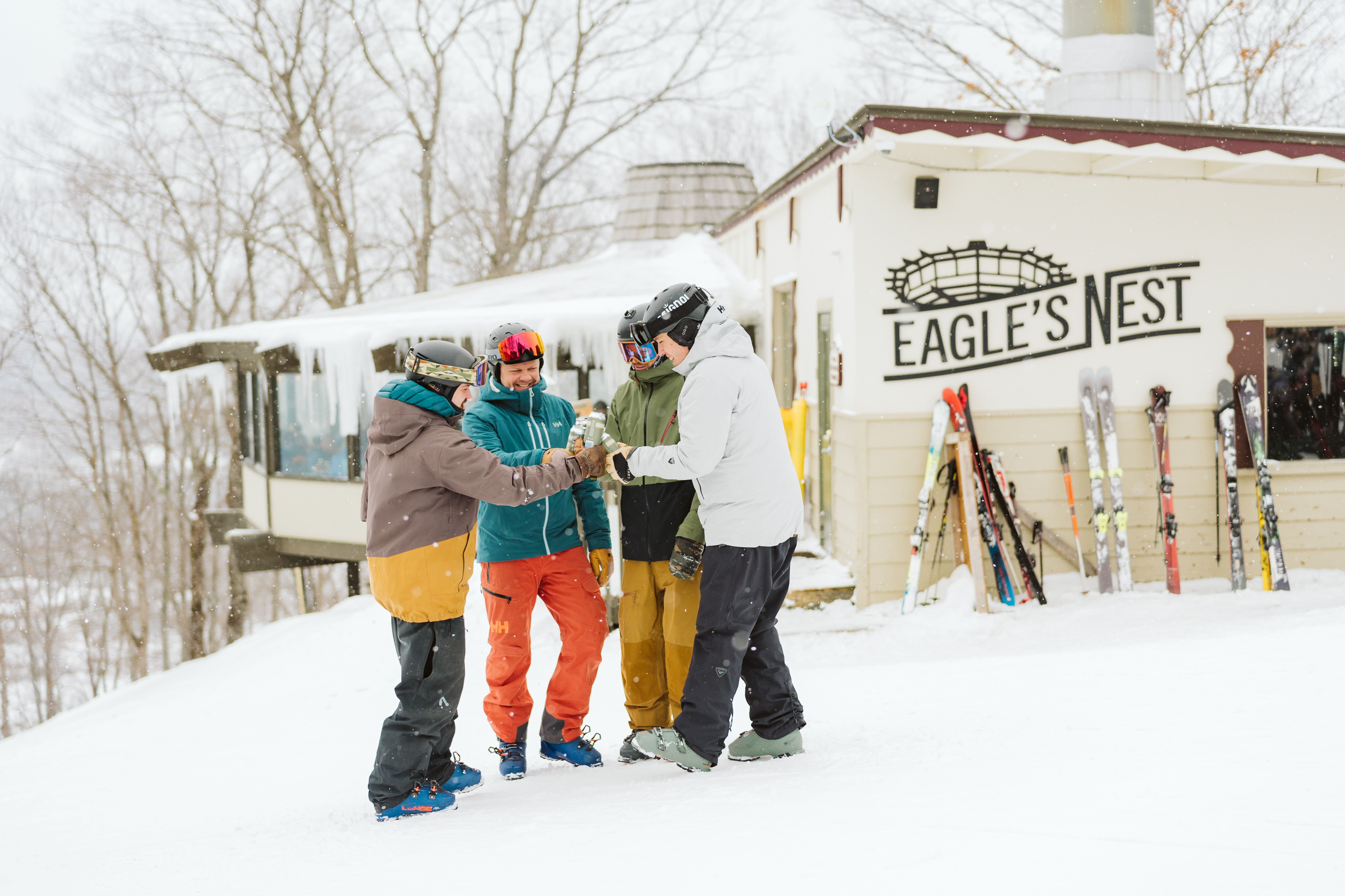 group of men at summit of mountain
