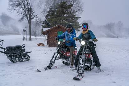 Two people riding MoonBikes at Boyne Mountain