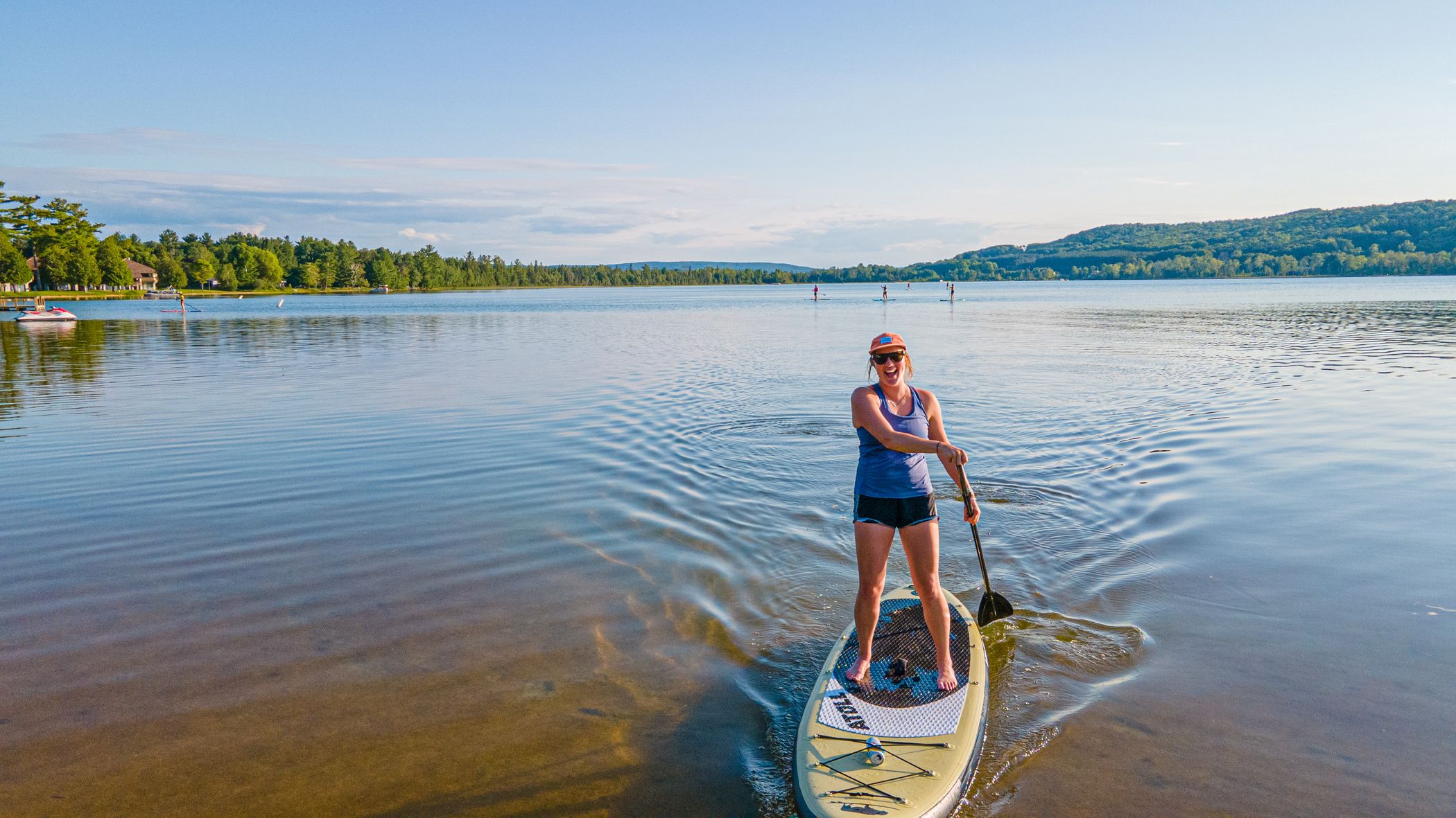 girl on paddleboard at deer lake