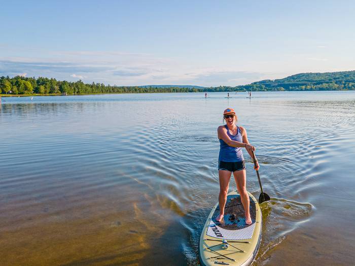 girl on paddleboard at deer lake