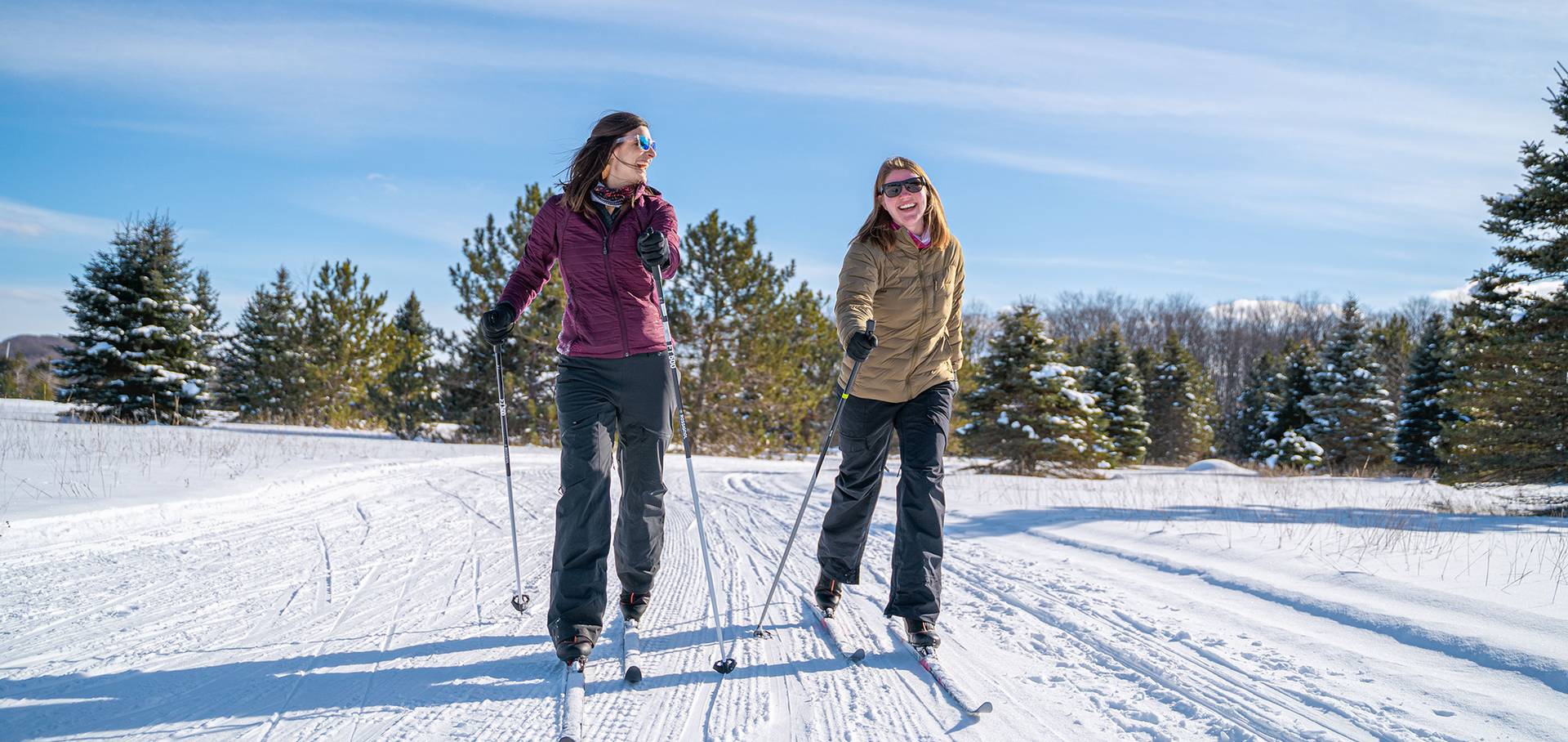 Two ladies cross country skiing