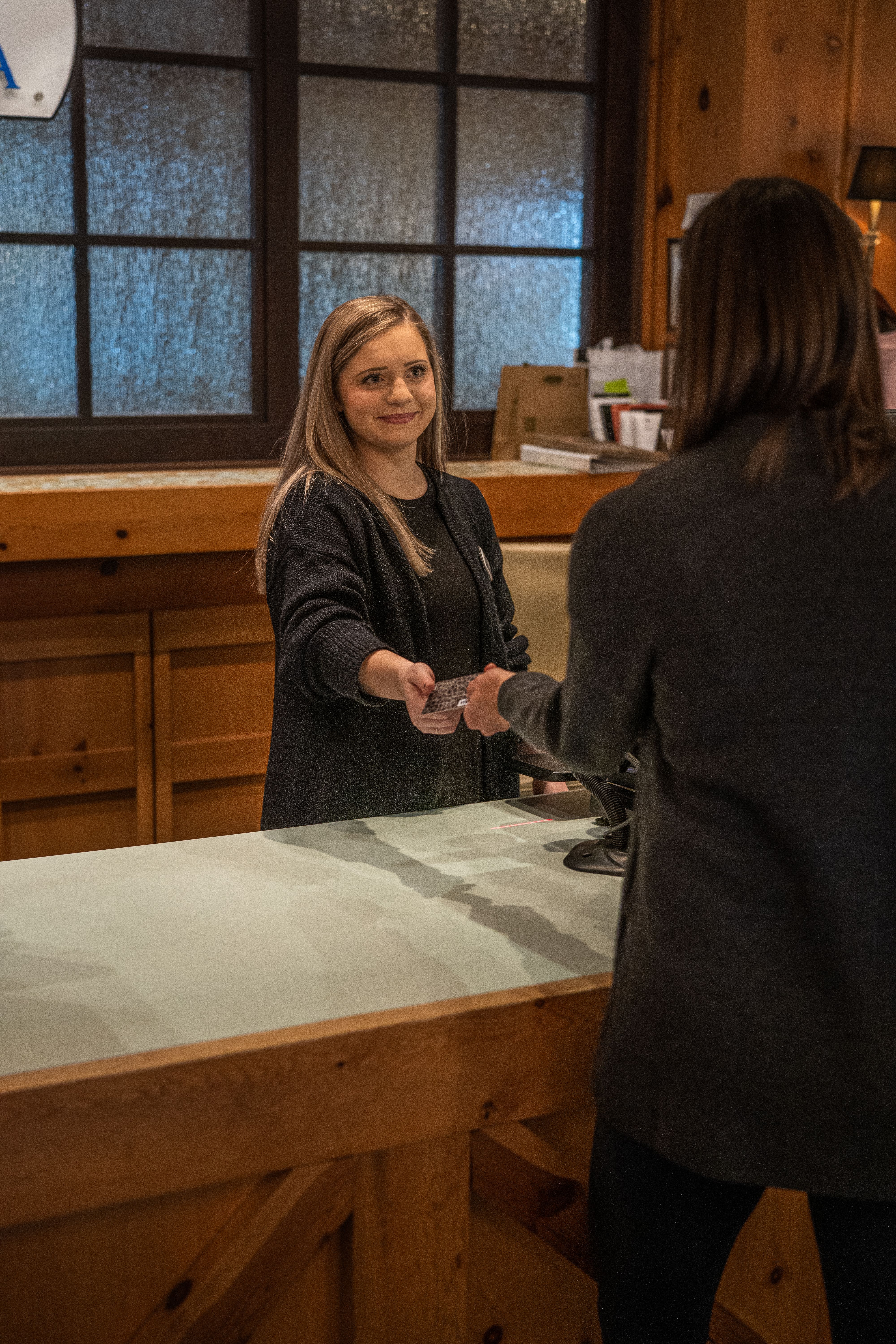 woman paying with credit card at The Spa