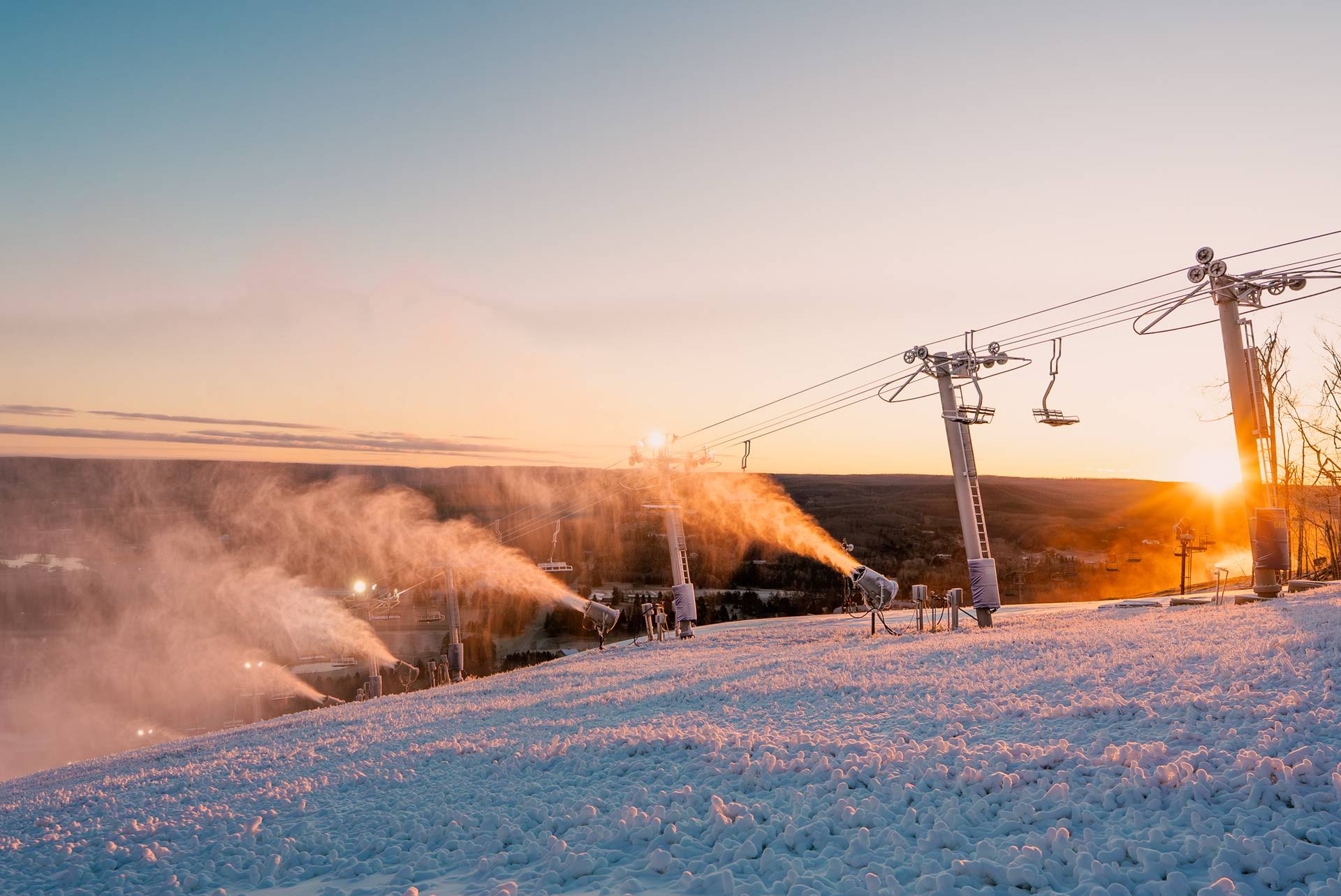 A sunrise on Victor Glacier with snow guns running
