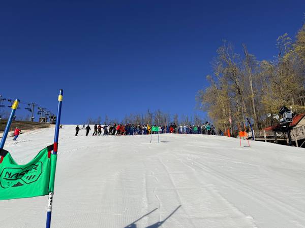 Group of Hemlock Open participants in front of Slalom Ski Race course