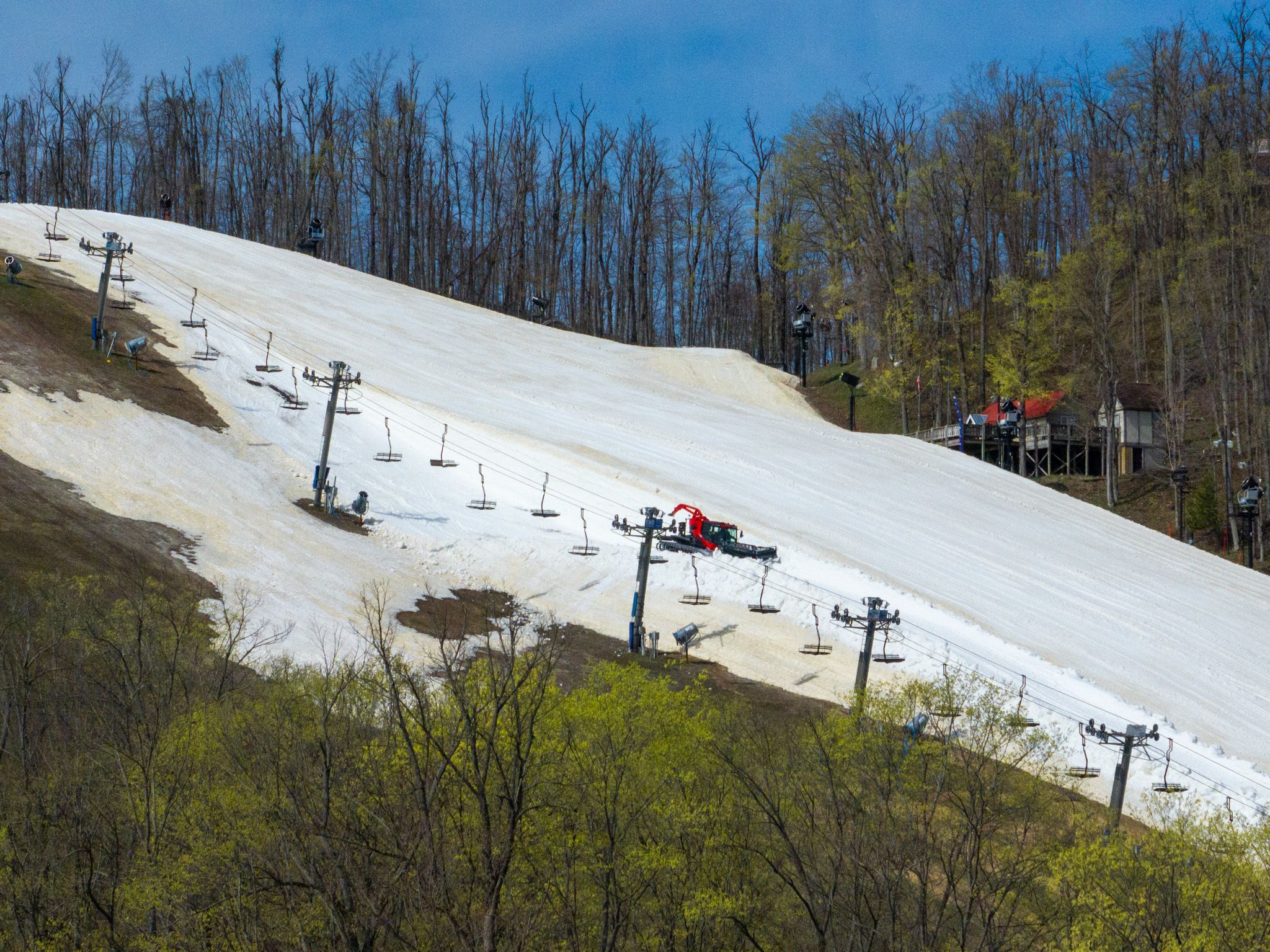 Groomer on Victor Glacier on sunny spring day