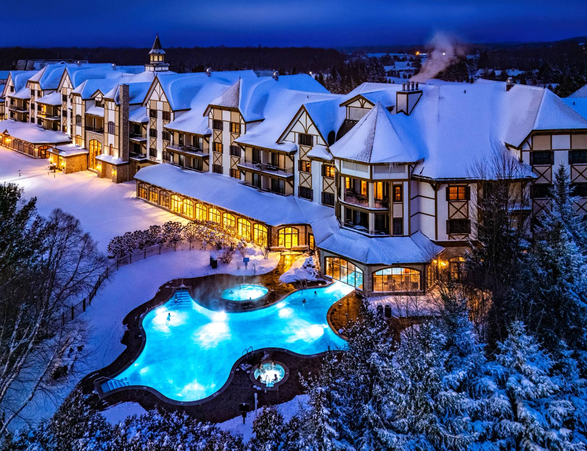 couples laughing outside of Chalet Edelweiss