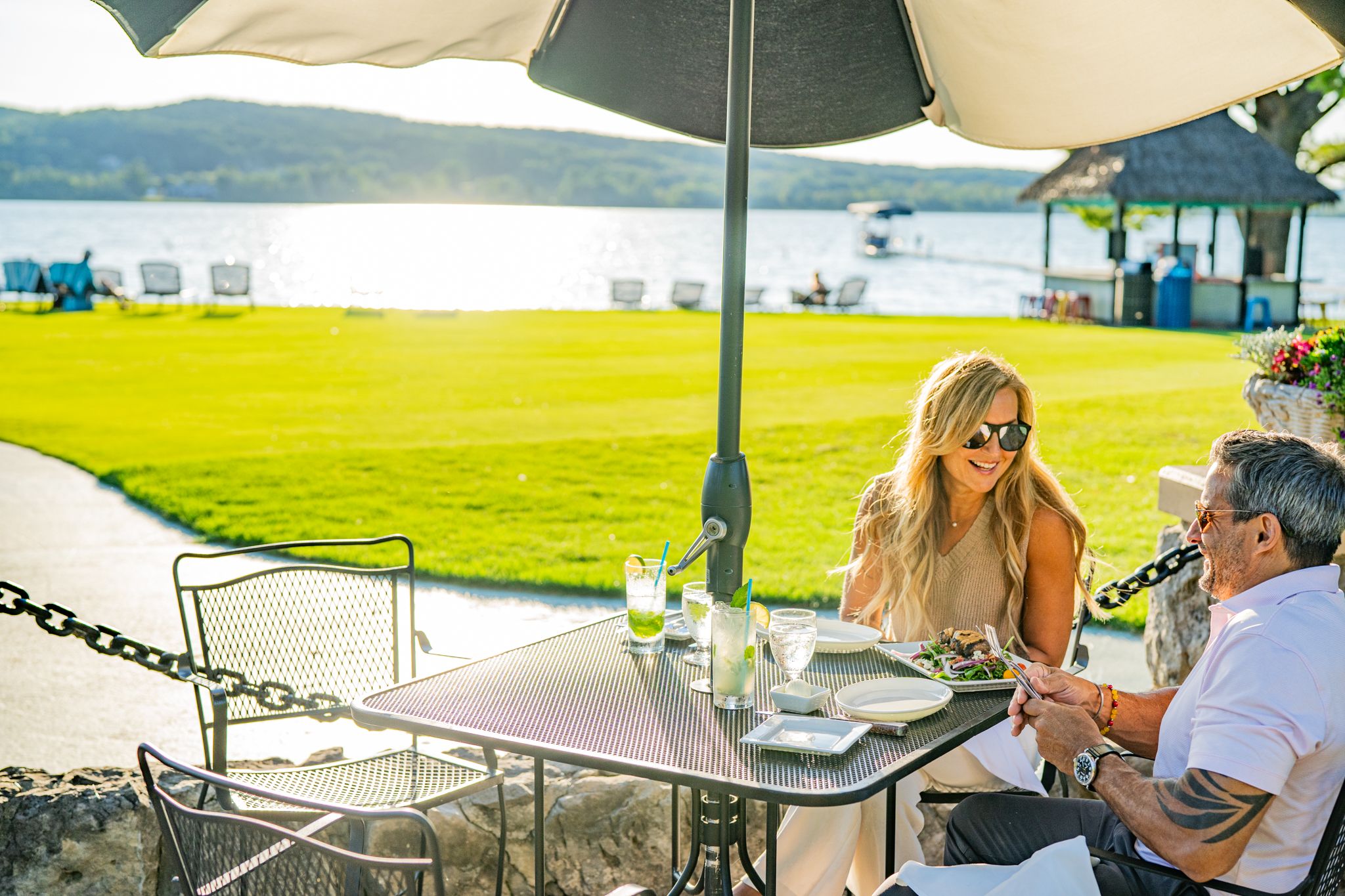 Couple enjoying a meal on the beach house patio