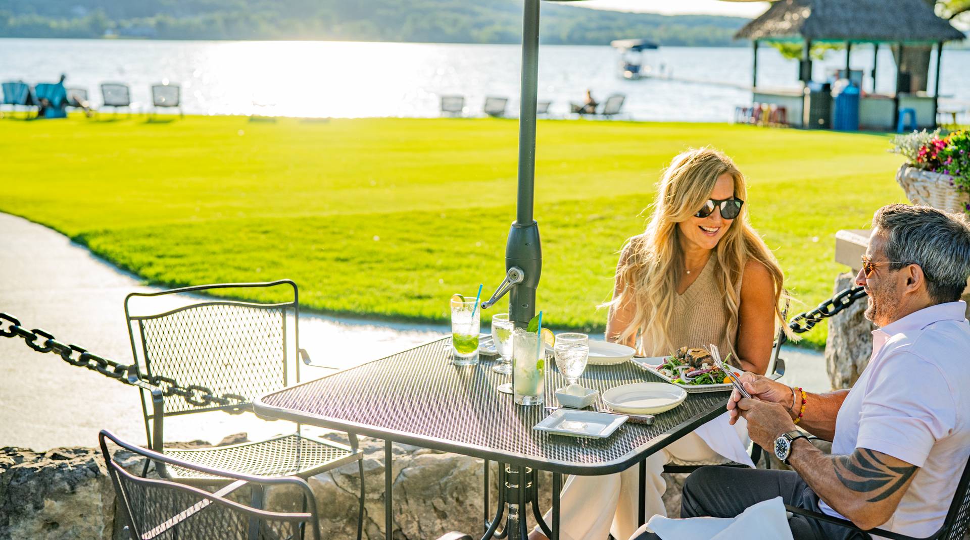 Couple enjoying a meal on the beach house patio