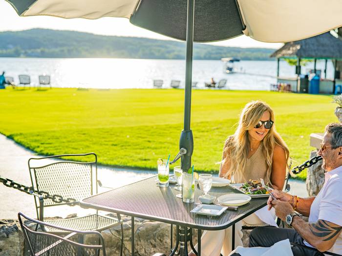 couple having dinner on beach house patio