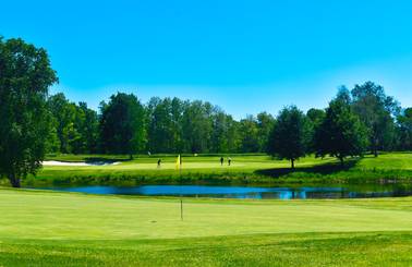 golfers putting on alpine course