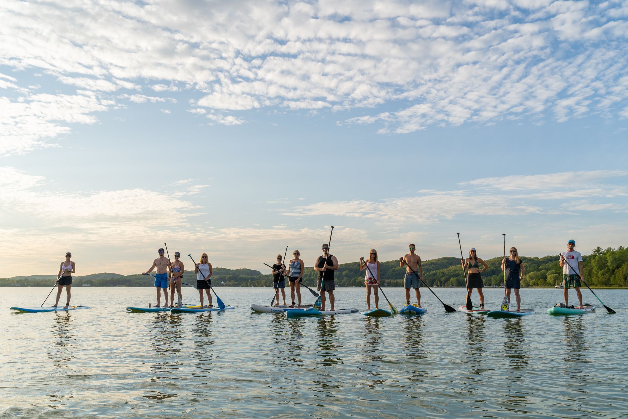 guests on paddle boards on deer lake