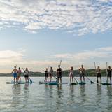 friends paddle boarding on deer lake