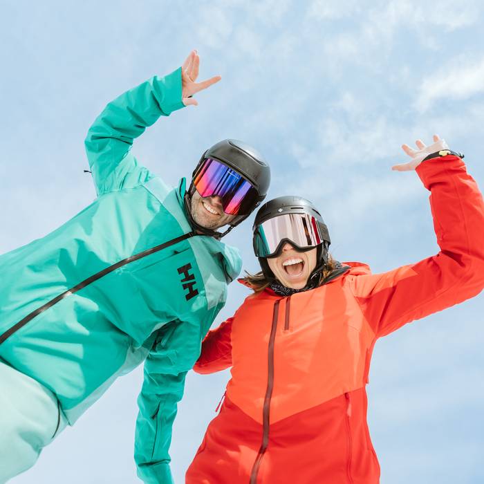 two skiers rejoicing