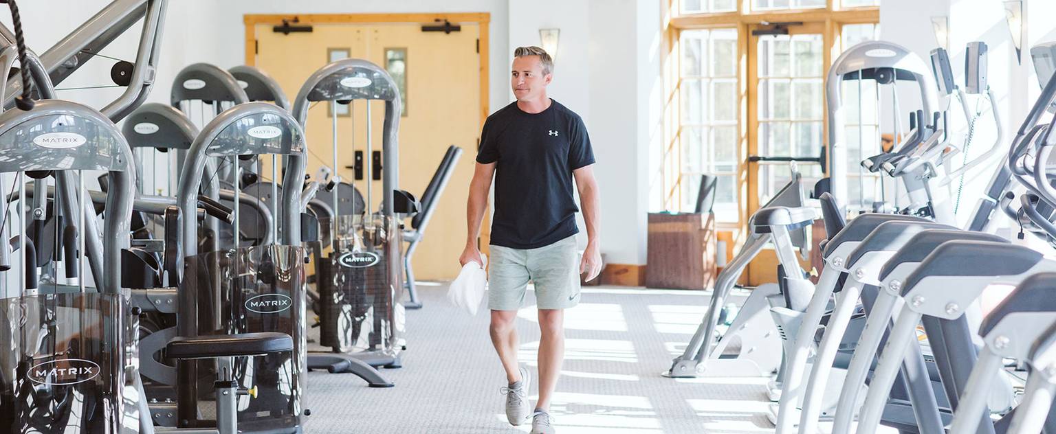 Man walking in the fitness center at The Spa