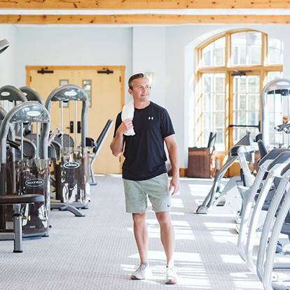 Man standing in the fitness center in The Spa at Boyne Mountain