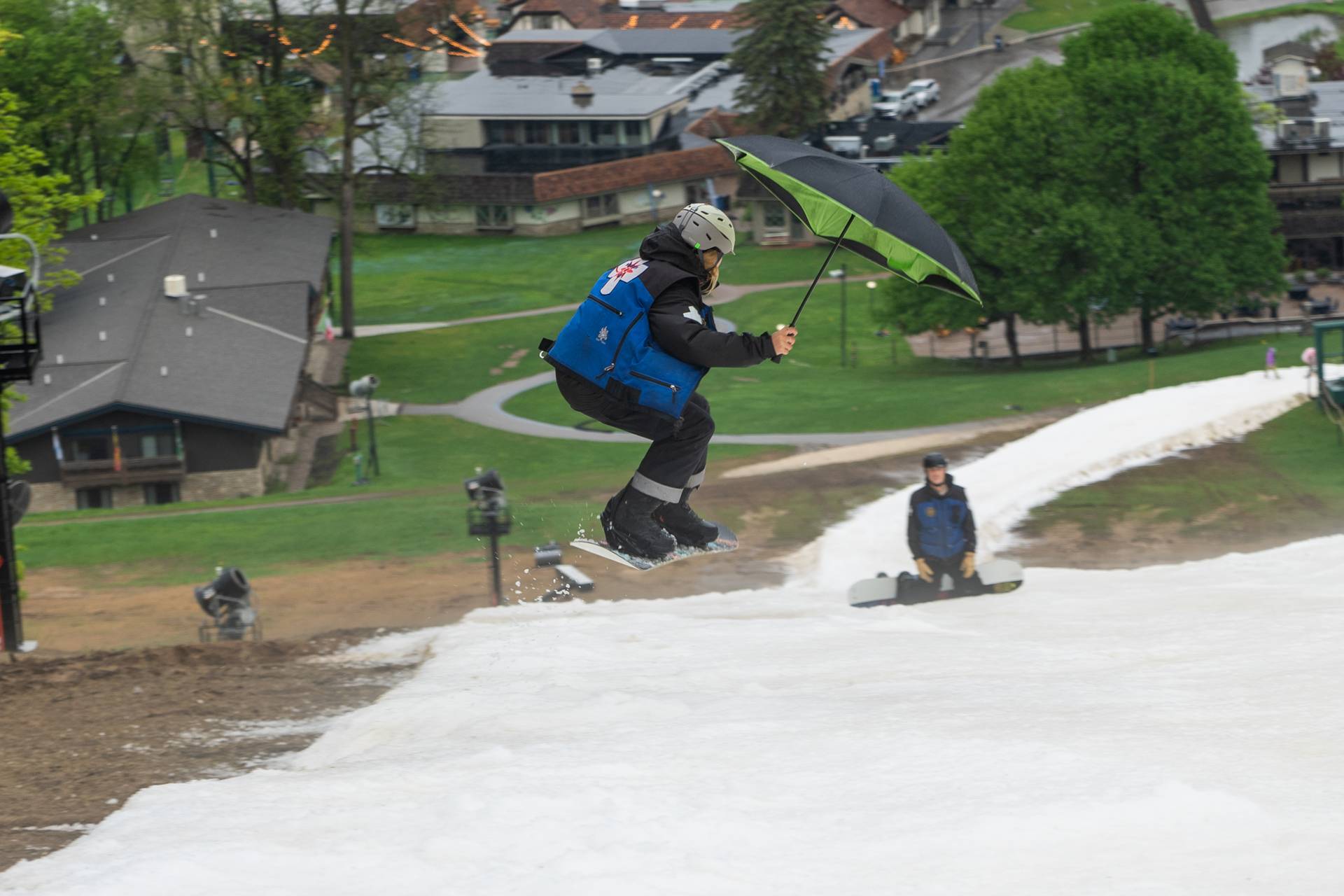 Snowboarder with umbrella on Victor Glacier