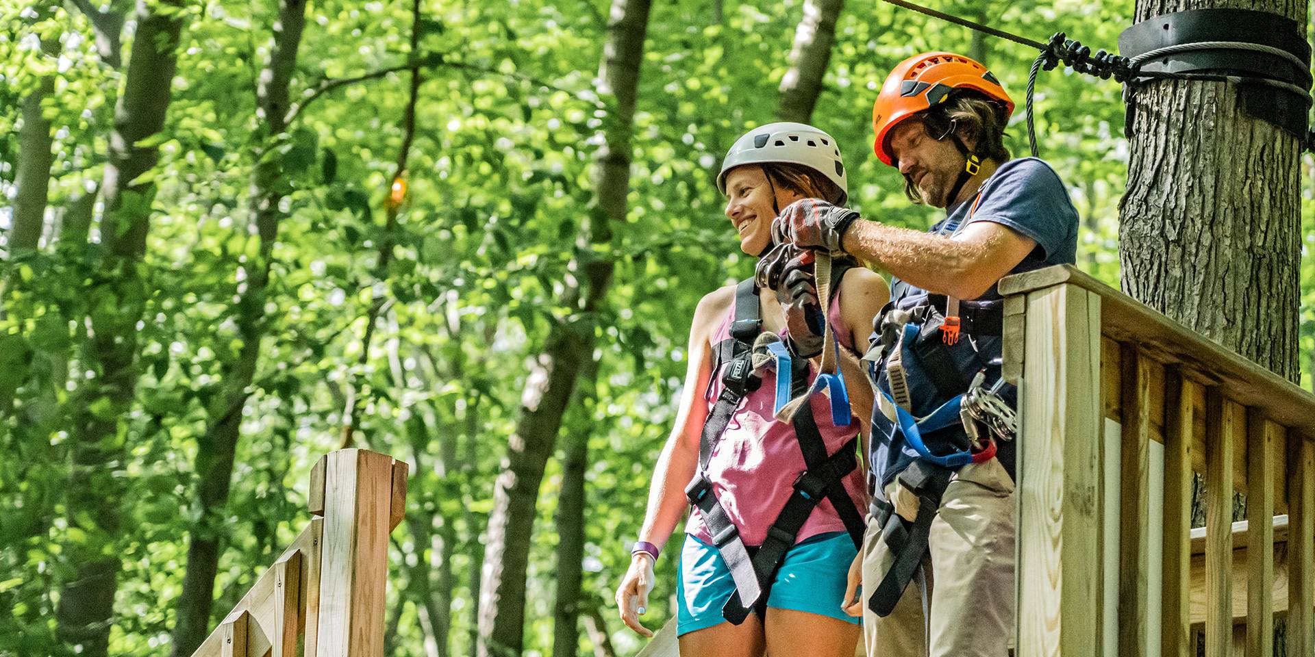Couple getting ready to zipline.